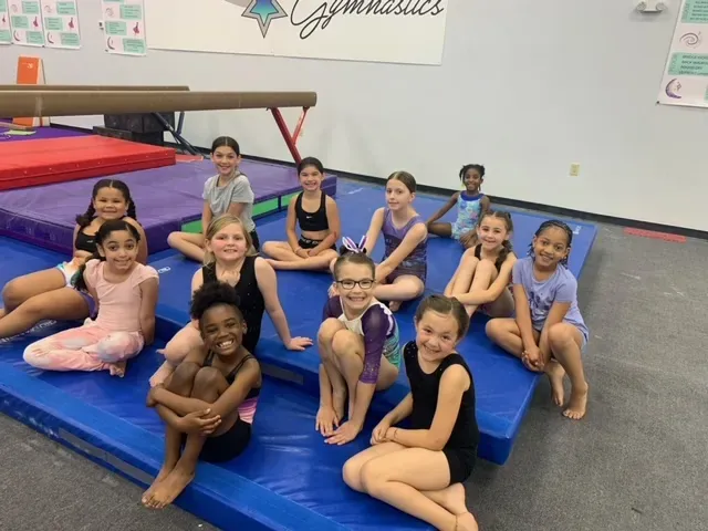 Galaxy Gymnastics competitive team athletes together in the gym